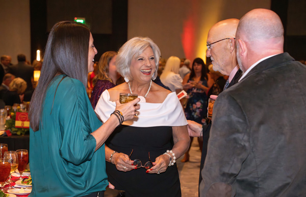 Gala scene: Attendees laughing and talking