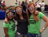 Three females wearing large, custom sunglasses